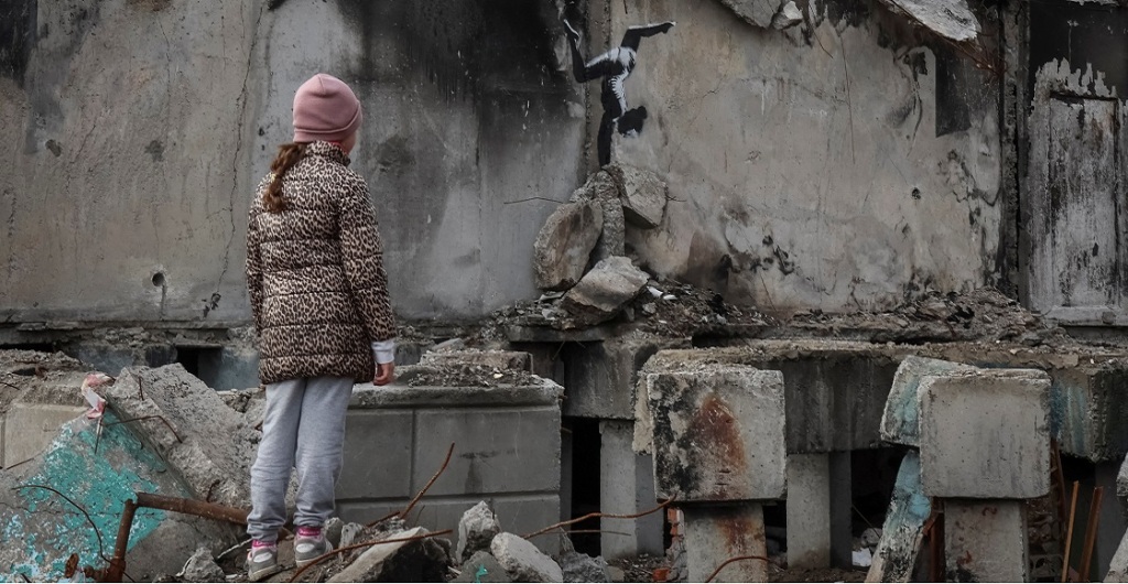 A work of world-renowned graffiti artist Banksy is seen at the wall of destroyed building in the Ukrainian town of Borodianka, which had been occupied by Russia until April and heavily damaged by fighting in the early days of Russian invasion, November 12, 2022.  