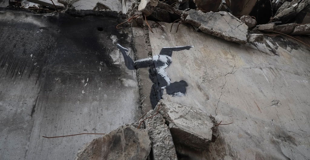 A work of world-renowned graffiti artist Banksy is seen at the wall of destroyed building in the Ukrainian town of Borodianka, which had been occupied by Russia until April and heavily damaged by fighting in the early days of Russian invasion, November 12, 2022.