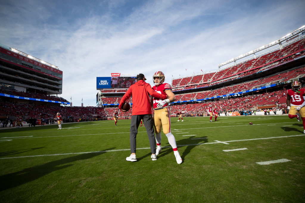 Kyle Shanahan y Christian McCaffrey